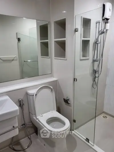 Modern bathroom with glass shower and sleek fixtures