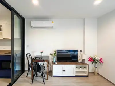 Modern living room with sleek furniture and air conditioning, perfect for cozy living.