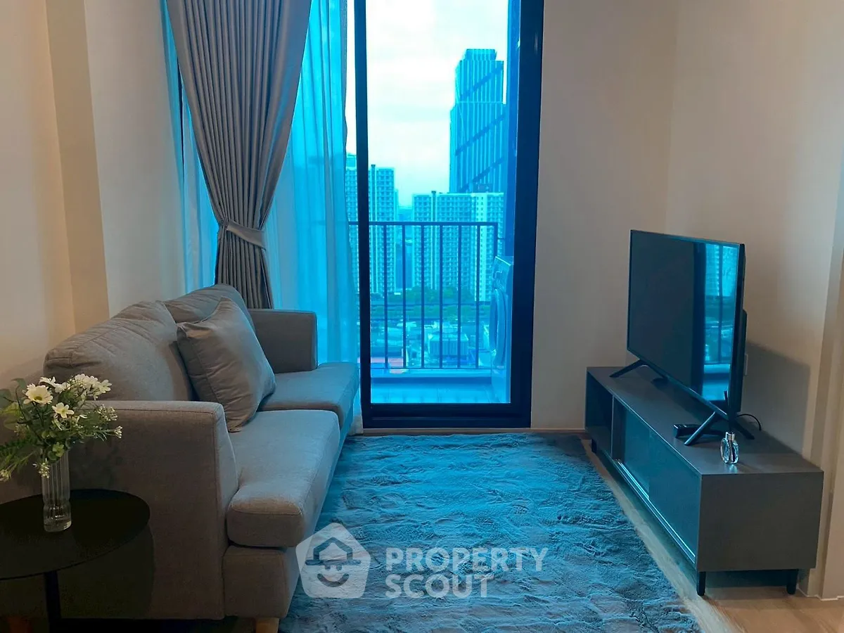 Modern living room with city view and cozy sofa setup