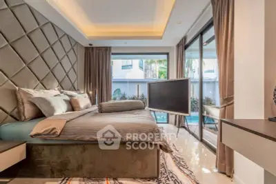 Luxurious bedroom with pool view and modern decor