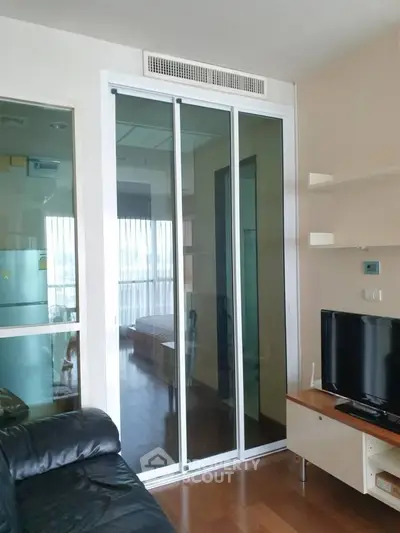 Modern living room with sliding glass doors and sleek furniture