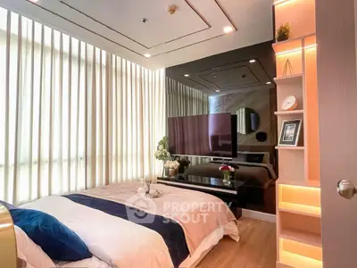 Luxurious bedroom with modern decor, large windows, and elegant lighting