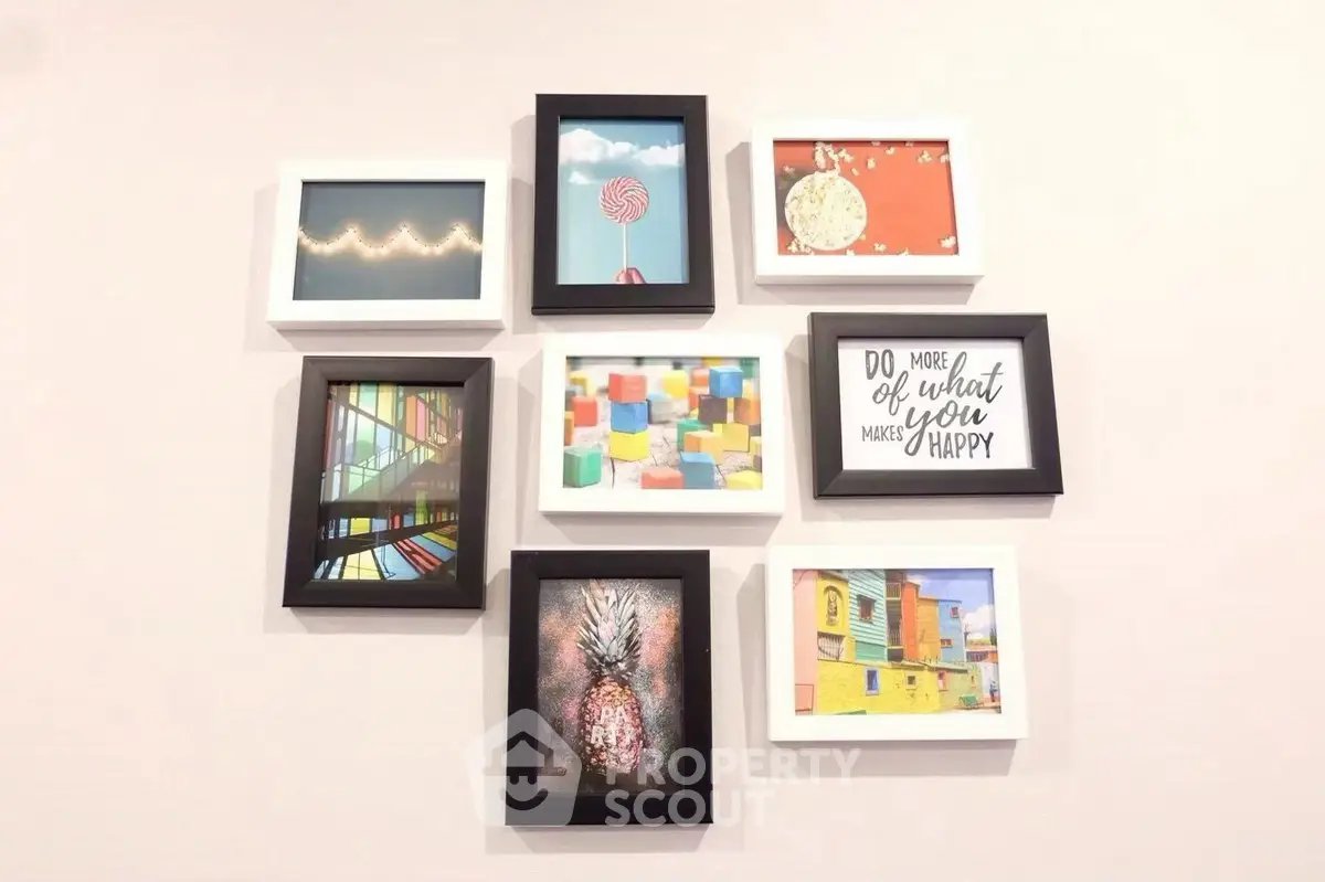 Stylish wall art arrangement in a modern living room interior.