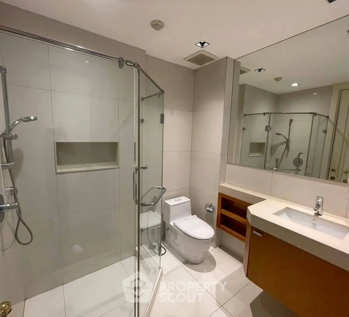 Modern bathroom with glass shower and sleek fixtures