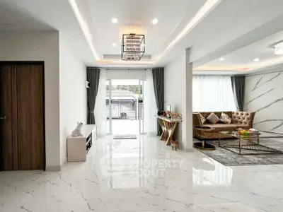 Spacious modern living room with elegant marble flooring and stylish decor