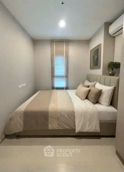 Cozy modern bedroom with stylish decor and natural light