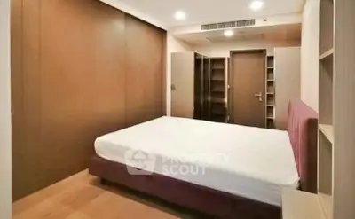 Spacious bedroom with modern design and ample storage space