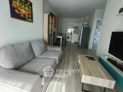 Modern living room with open kitchen and stylish decor in a cozy apartment