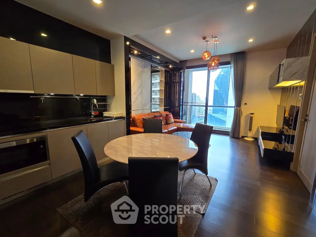 Luxurious modern living room with open kitchen and stunning city view