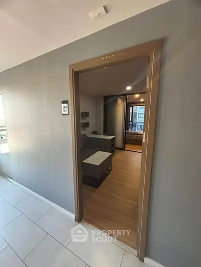 Modern apartment entrance with stylish interior and wooden flooring