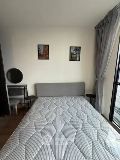 Modern bedroom with stylish decor and large window view