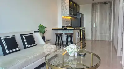 Modern living room with stylish kitchen and elegant decor