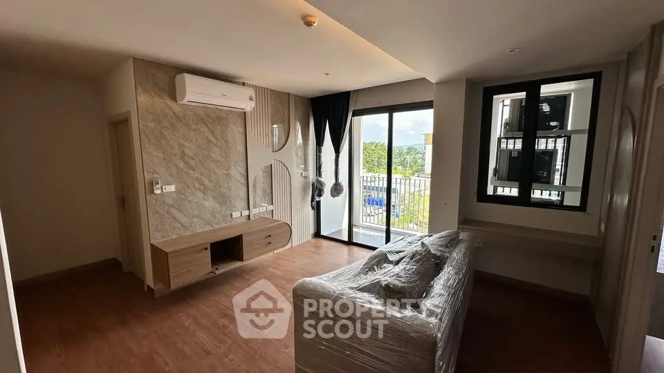 Modern living room with balcony view and stylish decor