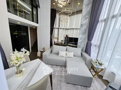 Luxurious modern living room with high ceilings and elegant decor