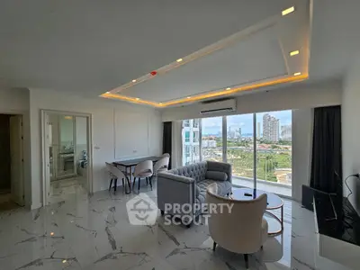 Spacious modern living room with city view and elegant furnishings.