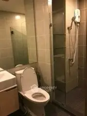 Modern bathroom with glass shower and sleek fixtures