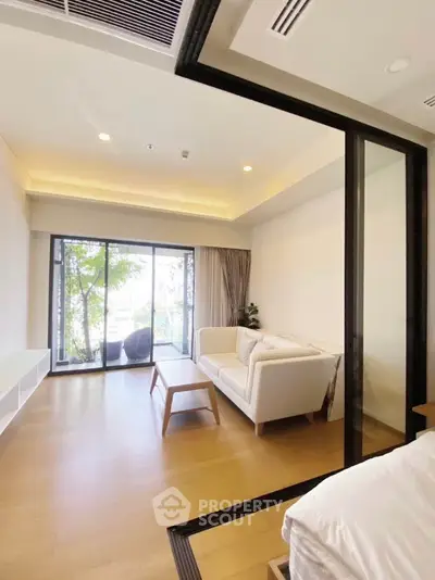 Modern living room with large windows and elegant decor