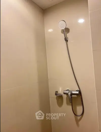 Modern bathroom shower with sleek design and neutral tiles