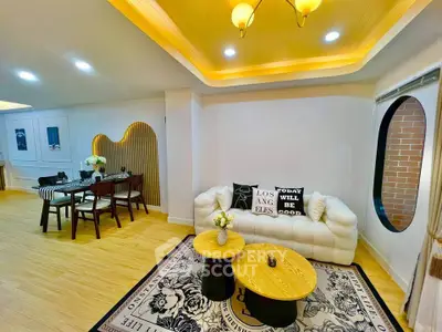 Stylish living room with modern decor and cozy dining area