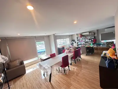 Spacious living room with modern decor and ample natural light