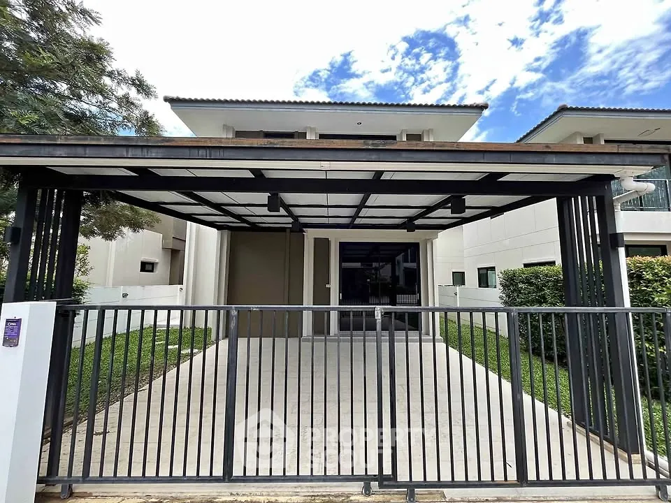 Modern house exterior with spacious driveway and sleek gate design