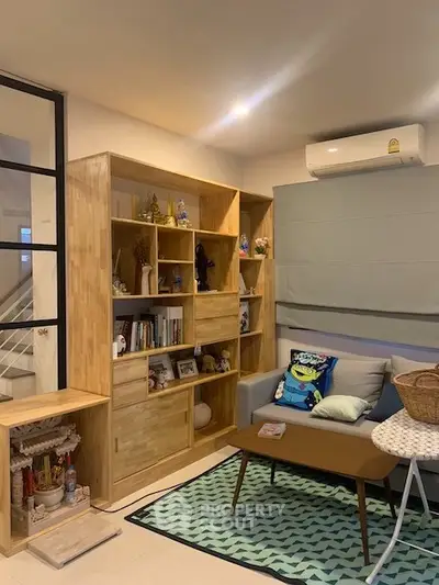 Cozy living room with modern wooden shelving and stylish decor