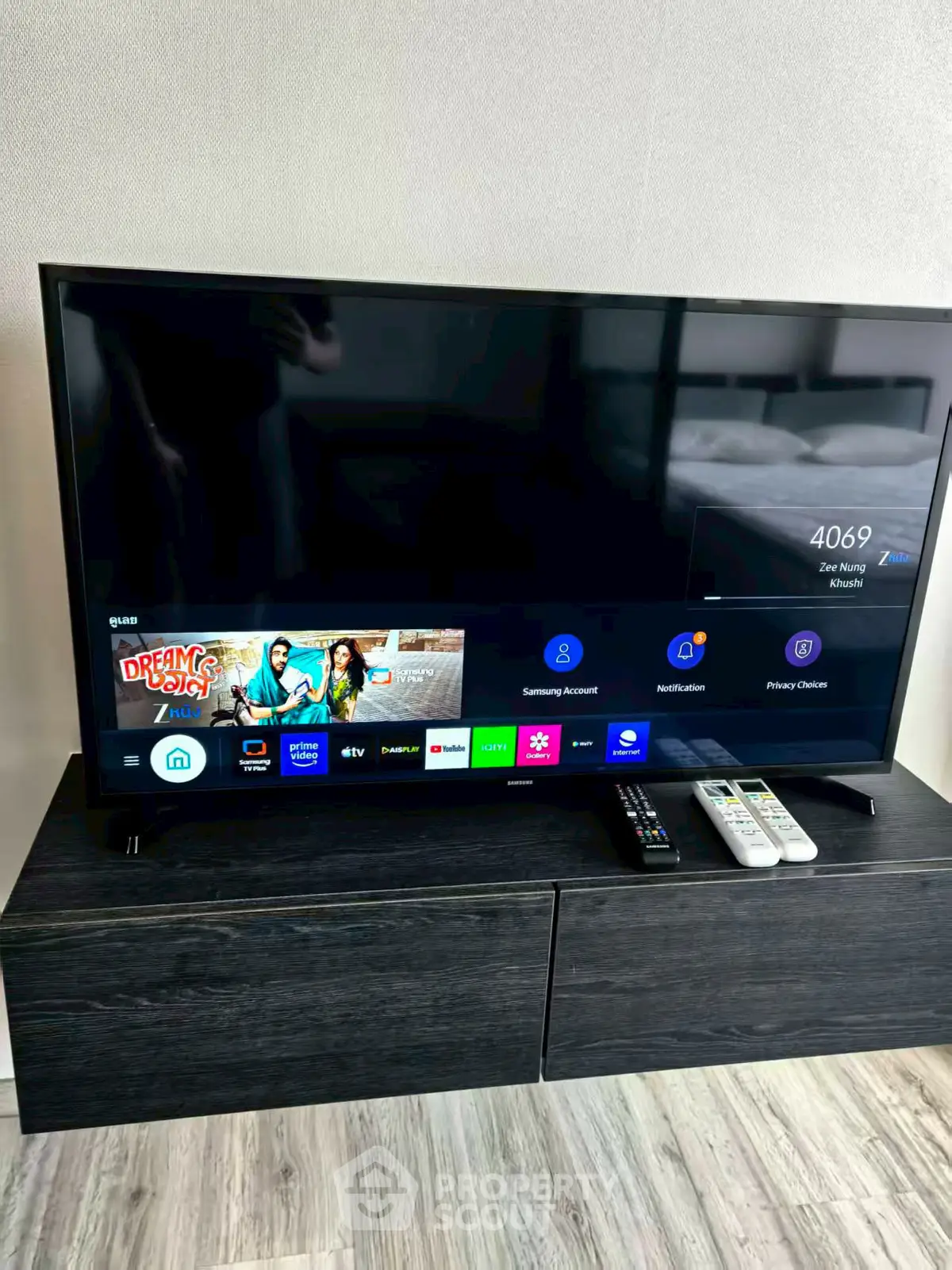 Modern living room with sleek TV setup on stylish cabinet