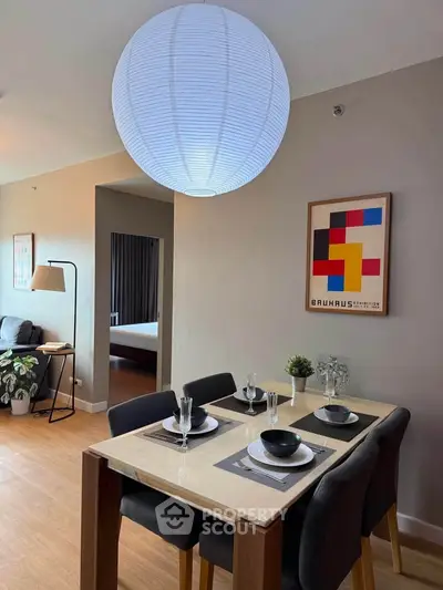 Modern dining area with stylish decor and elegant lighting in a contemporary apartment.