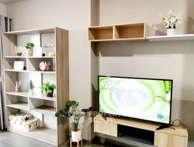 Modern living room with stylish shelving and TV unit, perfect for cozy home entertainment.