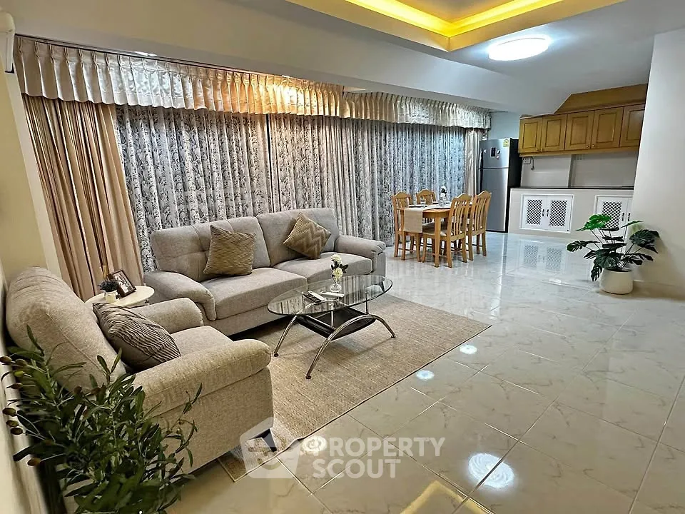 Spacious living room with elegant decor and dining area in modern apartment