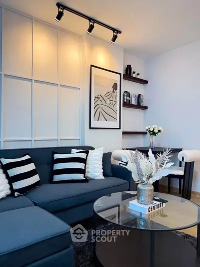 Stylish modern living room with elegant decor and cozy seating area.