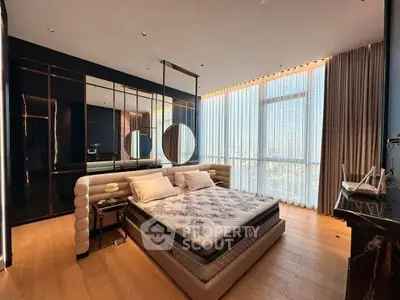 Luxurious bedroom with floor-to-ceiling windows and elegant decor