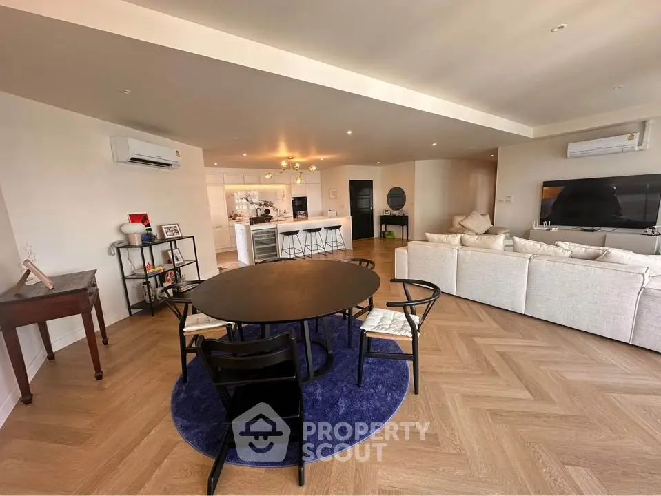 Spacious modern living room with open kitchen and stylish decor