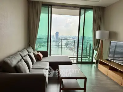 Spacious living room with stunning city view and modern furnishings
