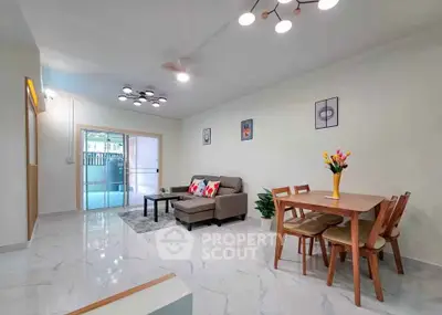 Spacious modern living room with elegant dining area and stylish decor