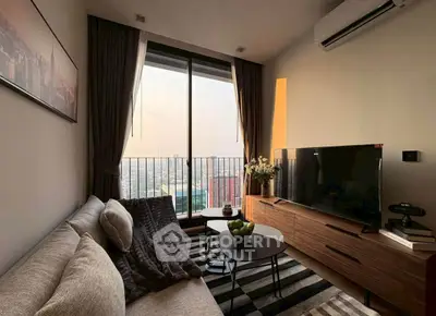 Cozy living room with modern decor and stunning city view from large window.