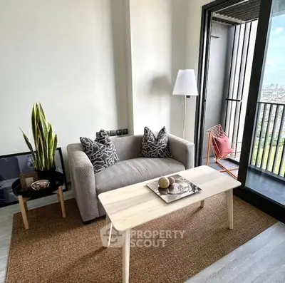 Chic modern living room with cozy sofa and balcony view