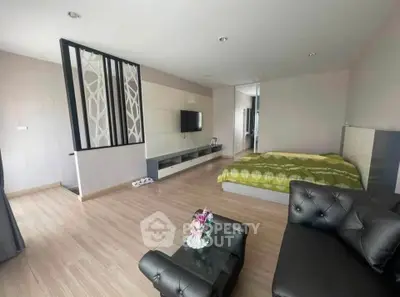 Spacious modern studio apartment with stylish decor and open layout