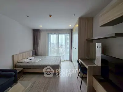 Modern bedroom with city view, featuring sleek furniture and natural light.