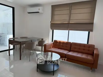 Modern living room with stylish furniture and natural light