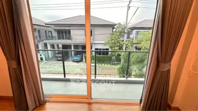 Spacious balcony with serene neighborhood view, perfect for relaxation and enjoying the outdoors.