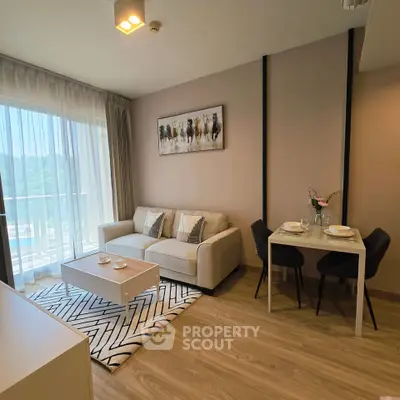 Modern living room with stylish decor and natural light in a contemporary apartment.