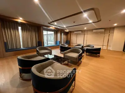 Spacious modern living room with elegant seating and large windows