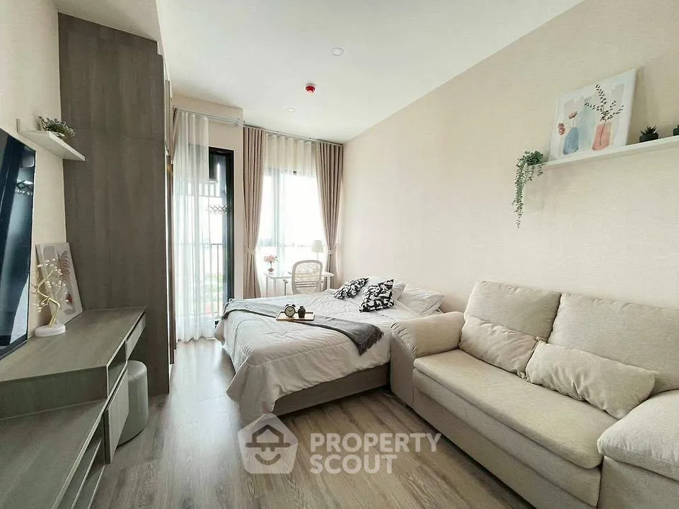 Modern living room with cozy sofa and stylish decor in a bright apartment.