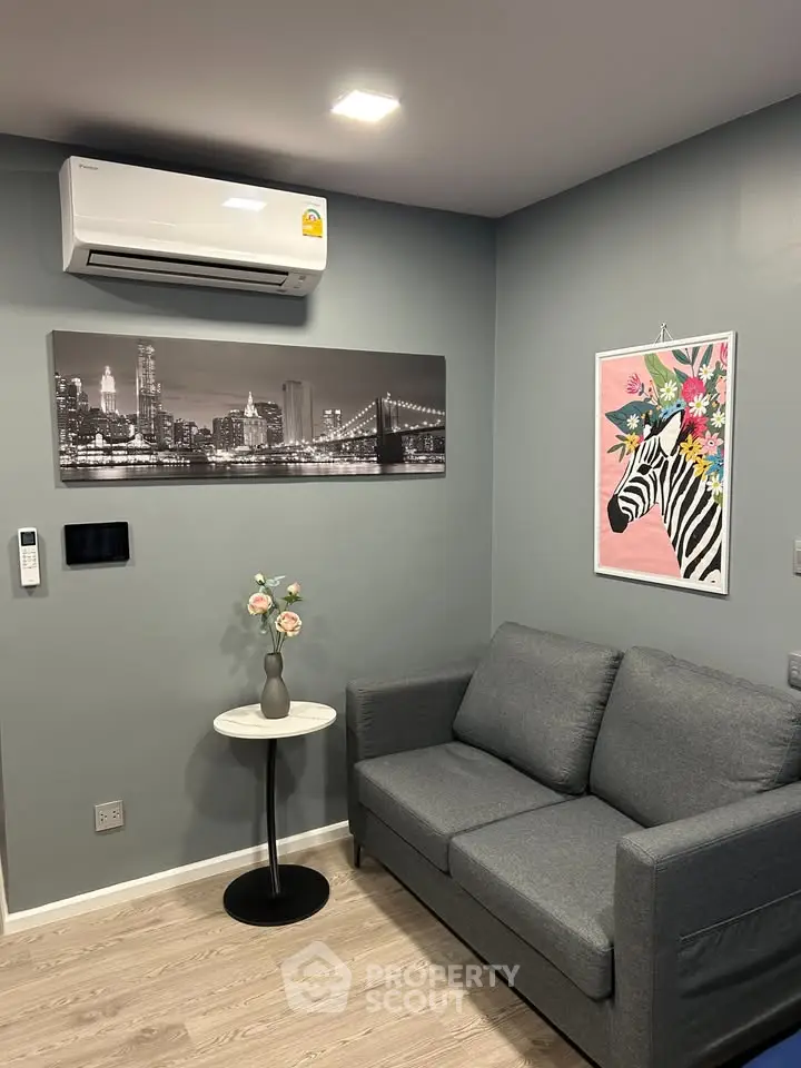 Modern living room with stylish decor and air conditioning