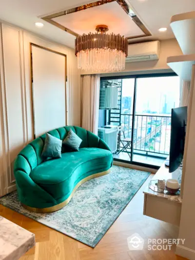 Luxurious living room with elegant green sofa and city view balcony, perfect for urban living.