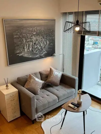 Modern living room with stylish decor and city view balcony.