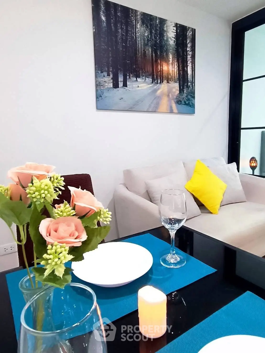 Chic modern living room with elegant dining setup and cozy sofa, perfect for stylish urban living.