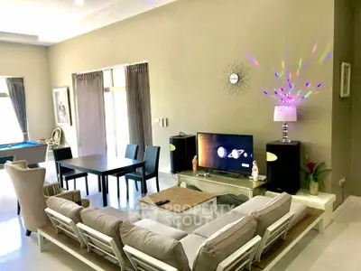 Spacious living room with modern decor and entertainment setup