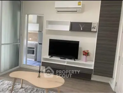 Modern living room with sleek TV unit and air conditioning in stylish apartment.